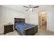 Bedroom featuring a ceiling fan, a bed, and an open doorway at 3813 Willow Branch Pl, Palmetto, FL 34221