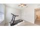 Bright bedroom with a treadmill for exercise, illuminated by natural light at 3813 Willow Branch Pl, Palmetto, FL 34221