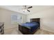 Bright bedroom showcasing a bed, carpeted floors and a window offering natural light at 3813 Willow Branch Pl, Palmetto, FL 34221