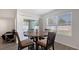 Dining area featuring a sliding glass door, round wooden table, and comfortable seating at 3813 Willow Branch Pl, Palmetto, FL 34221