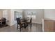 Dining area with a table, chairs, and sliding glass doors at 3813 Willow Branch Pl, Palmetto, FL 34221