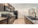 Modern kitchen with stainless steel appliances and granite countertops at 3813 Willow Branch Pl, Palmetto, FL 34221