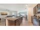 Spacious kitchen with a large island, stainless appliances, and an open floor plan at 3813 Willow Branch Pl, Palmetto, FL 34221