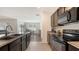 The kitchen features modern appliances and a convenient breakfast bar at 3813 Willow Branch Pl, Palmetto, FL 34221