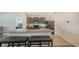Bright kitchen with an island, a breakfast bar, and stainless steel appliances at 3813 Willow Branch Pl, Palmetto, FL 34221