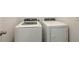 Modern white front-load washer and dryer set providing efficient laundry solutions at 3813 Willow Branch Pl, Palmetto, FL 34221