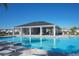 Inviting community pool featuring a covered pavilion and sun loungers, perfect for enjoying leisurely days and social gatherings at 3813 Willow Branch Pl, Palmetto, FL 34221