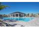 Relaxing community pool with covered pavilion and seating, perfect for swimming and socializing in a beautifully landscaped setting at 3813 Willow Branch Pl, Palmetto, FL 34221