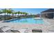 Beautiful community pool offering lounge chairs and a pavilion, perfect for relaxing and enjoying the Florida sunshine at 3813 Willow Branch Pl, Palmetto, FL 34221
