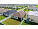 Aerial view of a well-maintained backyard with green lawn and white fence, perfect for outdoor activities at 3813 Willow Branch Pl, Palmetto, FL 34221