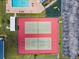 Aerial view of community tennis courts with green and red surfaces at 4214 38Th W St, Bradenton, FL 34205