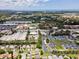 Aerial view showcasing the community with nearby shops and business complexes surrounded by lush green landscaping at 4214 38Th W St, Bradenton, FL 34205
