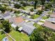 Aerial view of homes in a neighborhood and yellow pond nearby at 4214 38Th W St, Bradenton, FL 34205