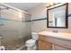 Bathroom features tiled shower, decorative blue border, modern vanity, and new fixtures at 4214 38Th W St, Bradenton, FL 34205
