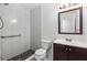 Updated bathroom featuring tiled shower, decorative mosaic floor, modern vanity, and new fixtures at 4214 38Th W St, Bradenton, FL 34205
