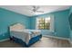 Relaxing bedroom features hardwood floors, light blue walls, and a bed with floral comforter at 4214 38Th W St, Bradenton, FL 34205