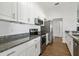 Updated kitchen with stainless appliances, granite countertops, and hardwood flooring at 4214 38Th W St, Bradenton, FL 34205