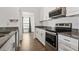 Updated kitchen featuring stainless appliances, granite countertops and hardwood flooring at 4214 38Th W St, Bradenton, FL 34205