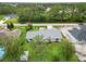 Aerial view of the home nestled among lush greenery in a quiet neighborhood at 4250 Winfall Ave, North Port, FL 34286