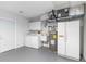 Spacious basement featuring a washer and dryer, utility sink, water heater, and refrigerator at 4250 Winfall Ave, North Port, FL 34286