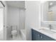 This bathroom offers bright marble floors, a shower and tub combo, and modern fixtures at 4250 Winfall Ave, North Port, FL 34286