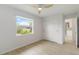 This bright bedroom features wood-look floors and a sliding door closet at 4250 Winfall Ave, North Port, FL 34286