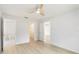 This bedroom features wood-look floors and easy access to the bathroom and closet at 4250 Winfall Ave, North Port, FL 34286