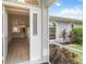 Inviting entryway view leading to a modern kitchen with new appliances and an island at 4250 Winfall Ave, North Port, FL 34286