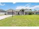 Attractive home with a spacious driveway, garage, and well-maintained lawn at 4250 Winfall Ave, North Port, FL 34286