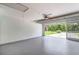 Spacious garage with epoxy floor, automatic door opener and access to outdoor views and natural light at 4250 Winfall Ave, North Port, FL 34286