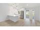 Contemporary kitchen featuring white cabinets, stainless steel appliances, and a kitchen island with bar seating at 4250 Winfall Ave, North Port, FL 34286