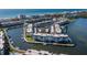 Aerial view of waterfront condos with canal access and boat docks near beaches and local attractions at 4420 Exeter Dr # 303, Longboat Key, FL 34228