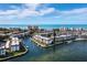 Beautiful aerial shot of waterfront condos with private boat docks, showcasing luxury coastal living at 4420 Exeter Dr # 303, Longboat Key, FL 34228