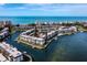 Stunning aerial view of a waterfront community with condos, docks, and scenic water views at 4420 Exeter Dr # 303, Longboat Key, FL 34228