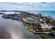 Aerial view of condos with canal access and boat docks with beautiful bay views for a peaceful lifestyle at 4420 Exeter Dr # 303, Longboat Key, FL 34228