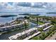 Panoramic aerial view of waterfront condo community with boat docks and stunning ocean views at 4420 Exeter Dr # 303, Longboat Key, FL 34228