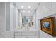Charming bathroom vanity featuring custom mirror and ample counter space at 4420 Exeter Dr # 303, Longboat Key, FL 34228