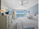 Relaxing bedroom showcasing water views, white furnishings, and shuttered windows at 4420 Exeter Dr # 303, Longboat Key, FL 34228