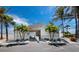 Clubhouse with inviting entrance and tropical landscaping and access to the beach at 4420 Exeter Dr # 303, Longboat Key, FL 34228