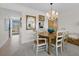 Charming dining area with chandelier and seating for six at 4420 Exeter Dr # 303, Longboat Key, FL 34228
