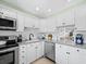 Well-appointed kitchen featuring granite countertops, stainless steel appliances, and ample cabinet space at 4420 Exeter Dr # 303, Longboat Key, FL 34228