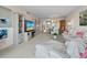 Spacious living room features plush seating, elegant decor, and a view into the dining area at 4420 Exeter Dr # 303, Longboat Key, FL 34228