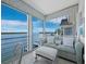 Relaxing sunroom featuring water views, a comfortable sofa, and neutral decor at 4420 Exeter Dr # 303, Longboat Key, FL 34228