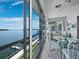 Bright, airy sunroom with expansive glass and water views, perfect for relaxing or entertaining at 4420 Exeter Dr # 303, Longboat Key, FL 34228