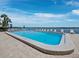 Enjoy the large, sparkling swimming pool overlooking the waterfront, perfect for relaxation and recreation at 4420 Exeter Dr # 303, Longboat Key, FL 34228