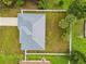 Aerial view showcases the property's layout, metal roof, and fully fenced backyard at 4855 Dragon St, North Port, FL 34288