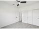 A bright bedroom with modern tile flooring, an open door and a closet at 4855 Dragon St, North Port, FL 34288