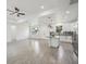 Open-concept living area with kitchen island, tile flooring, recessed lights, and modern fixtures at 4855 Dragon St, North Port, FL 34288
