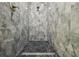 Elegant shower with gray marble tile and black marble flooring at 4855 Dragon St, North Port, FL 34288