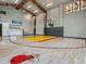Full indoor basketball court with Miami Heat insignia, high ceilings, and championship banners for 2006, 2012, and 2013 at 4907 Topsail Dr, Nokomis, FL 34275